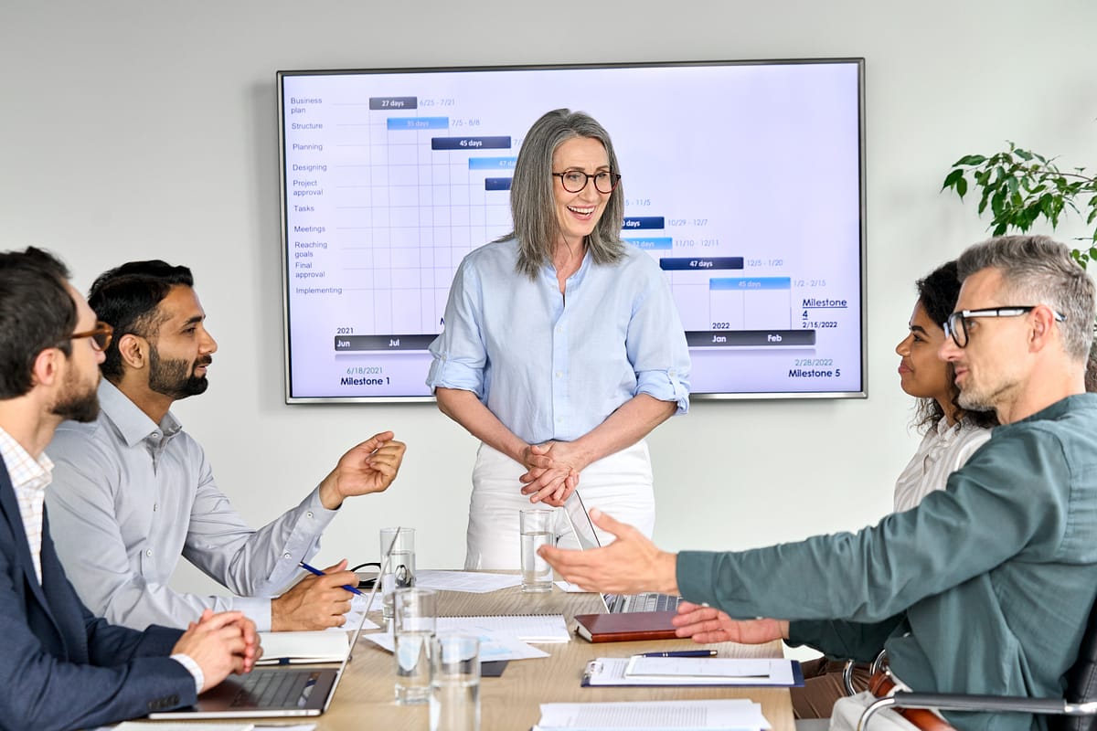 happy-diverse-corporate-team-having-presentation-i-2025-02-11-16-22-32-utc